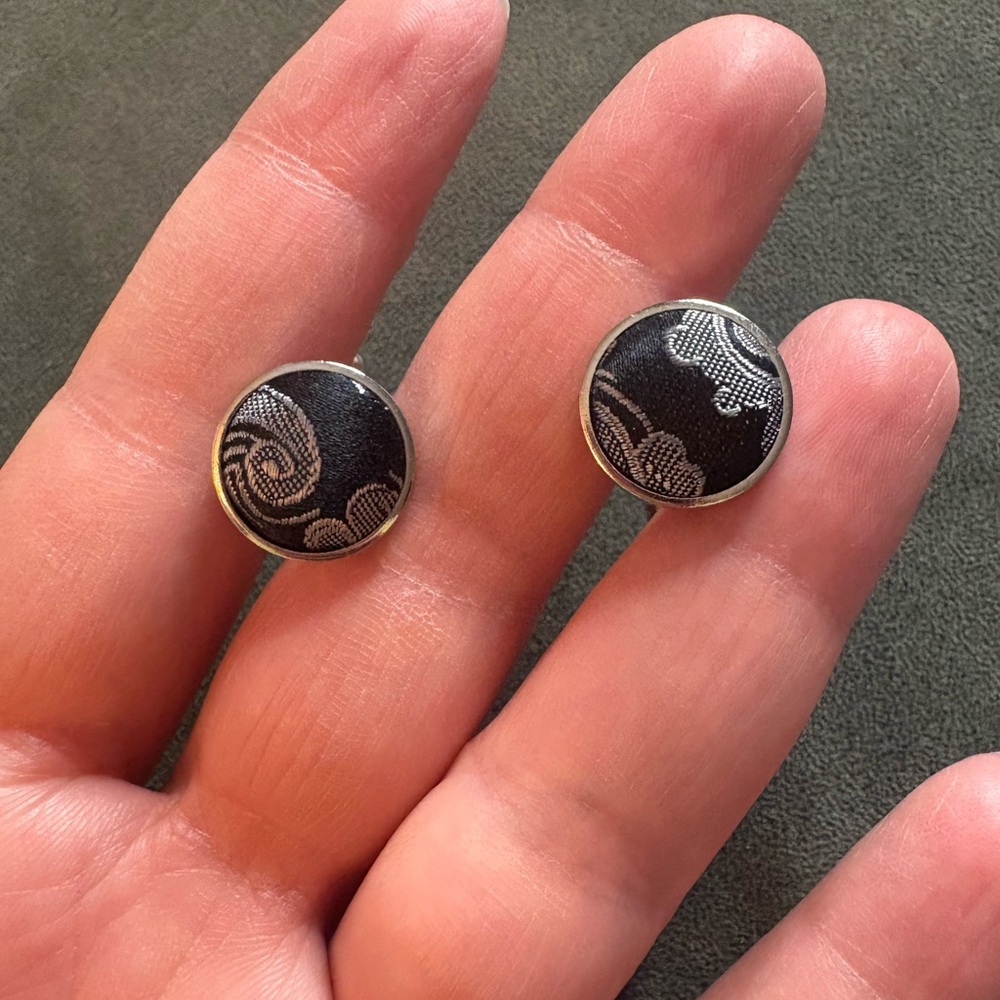 Pair of round silver-tone cufflinks